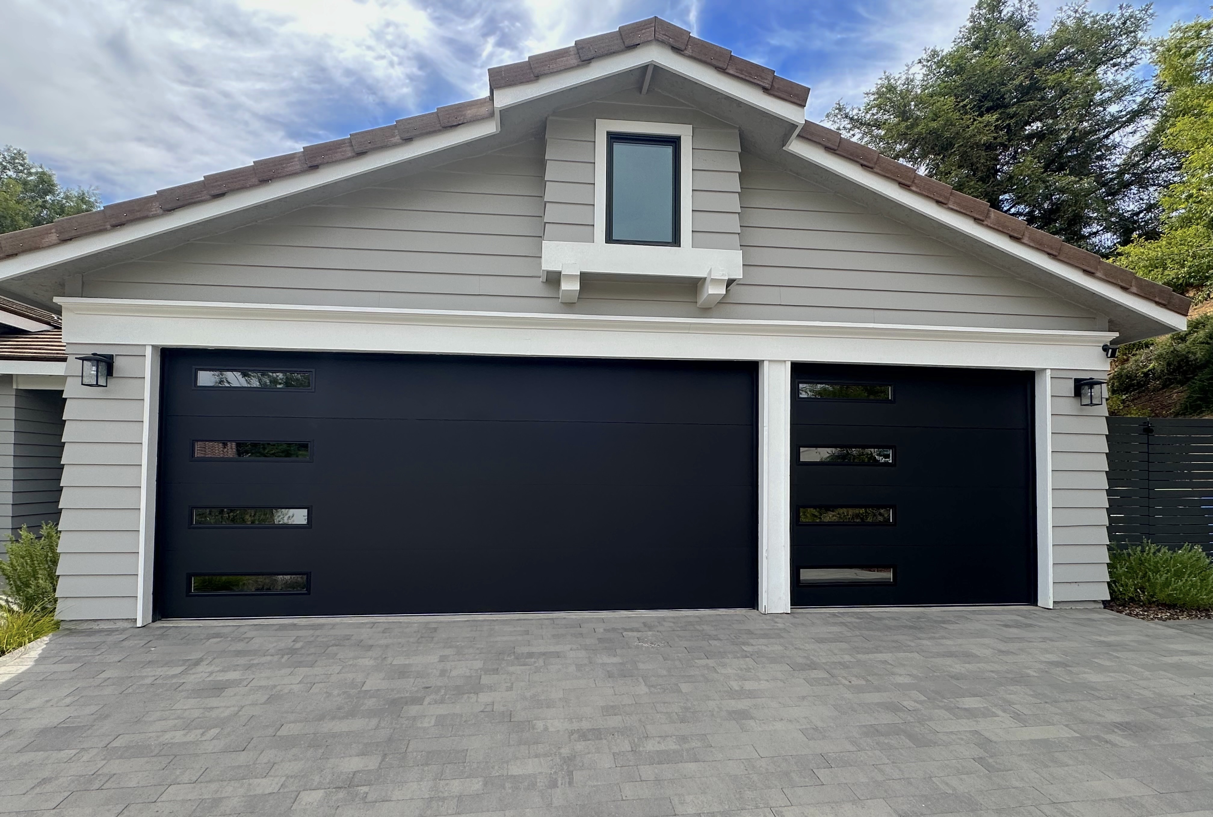Clopay Modern Steel with Contemporary Windows Premium Series with Intellicore 9208 in Lustra Black with Clear Glass Slim Windows
